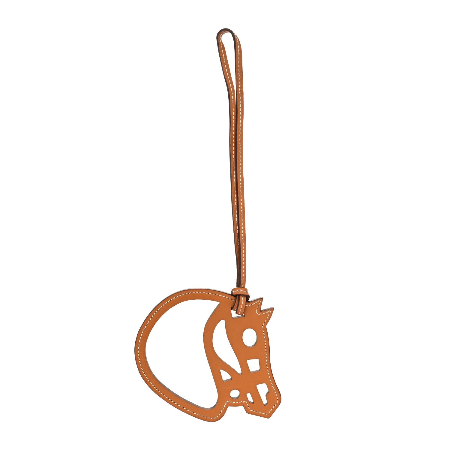 this is an image of an HERMES Swift Paddock Cheval Horse Bag Charm in the color Gold by fashionphile