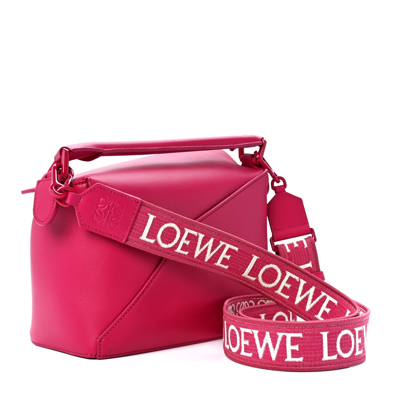 this is a side view image of LOEWE Satin Calfskin Puzzle Edge Bag in size small in the color Ruby Red Glaze by fashionphile
