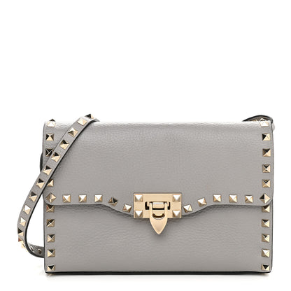 Valentino Garavani Pebbled Calfskin Medium Rockstud Flip Lock Crossbody Bag Pastel Grey 1 of 7