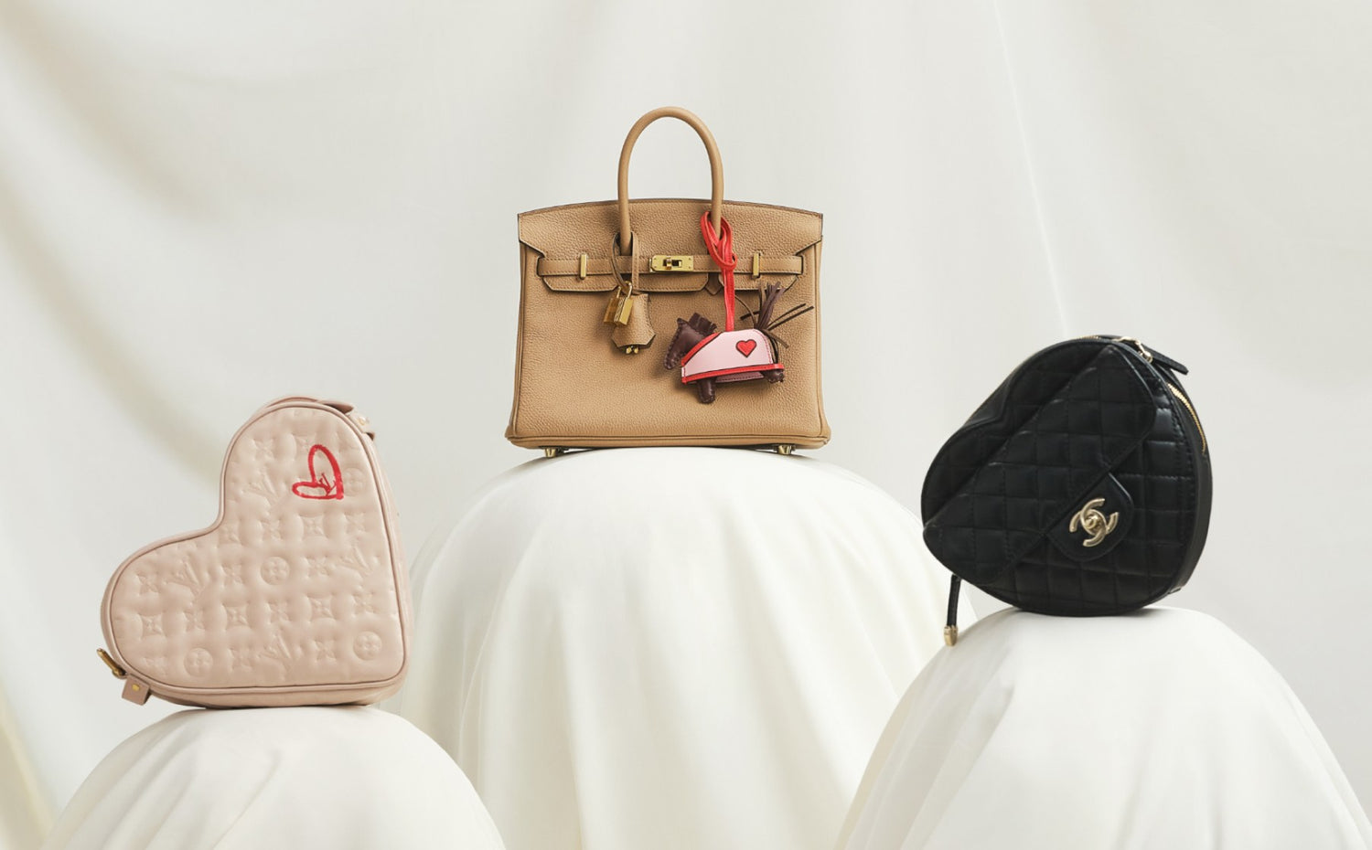 one light pink heart shaped Louis Vuitton monogram bag, one tan color Hermes Birkin 25 bag, and one black heart shaped Chanel bag