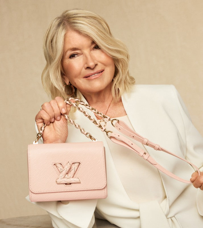 Martha Stewart in a white suit holding a LOUIS VUITTON Epi Enamel Wave Twist Shoulder Bag PM Rose Jasmin