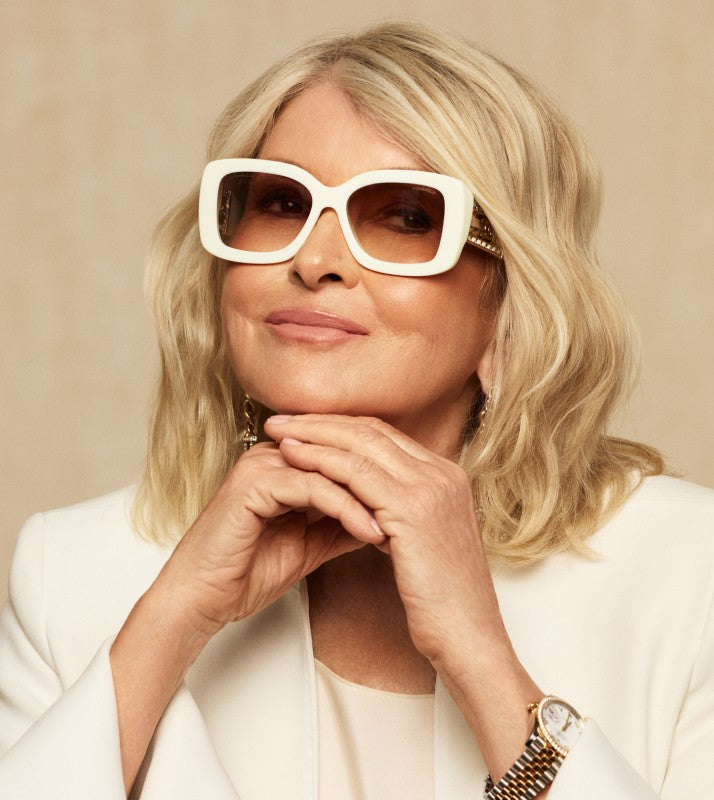 Martha Stewart in a white suit wearing white Chanel sunglasses