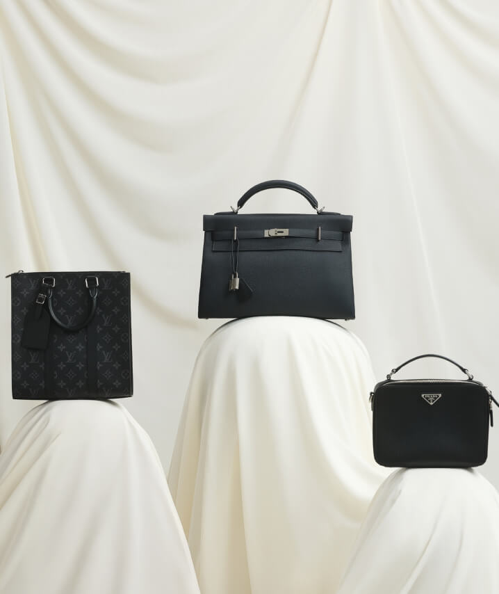 one Louis Vuitton monogram black tote bag, one black Hermes Kelly briefcase, and one black Prada briefcase