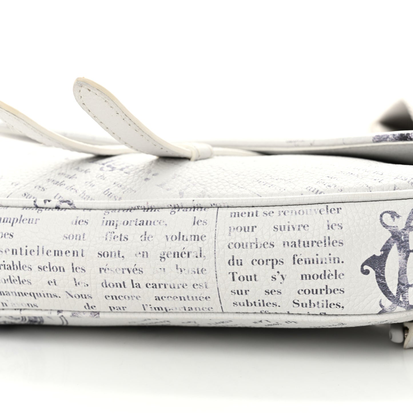 X DANIEL ARSHAM Grained Calfskin Newspaper Print Saddle Bag White