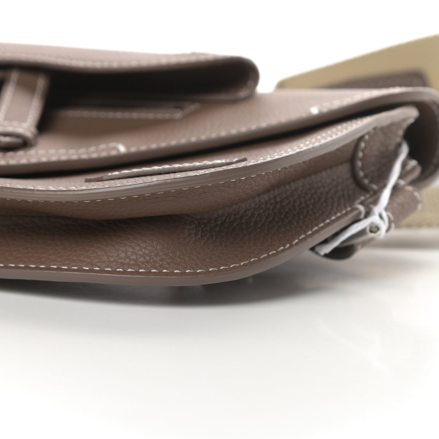 X KAWS Grained Calfskin Saddle Pouch Marron Multicolor