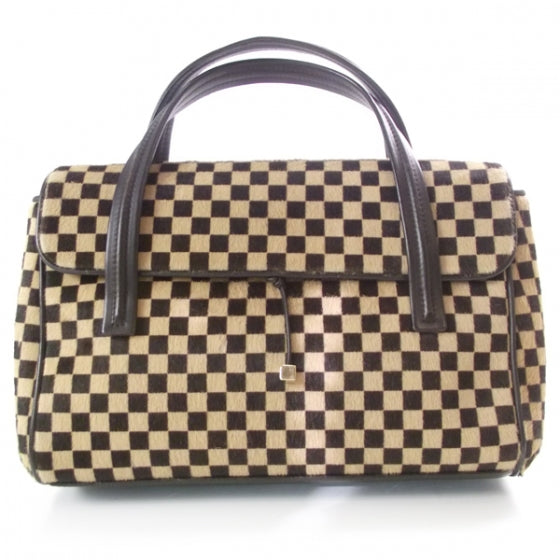 Damier Sauvage Lionne