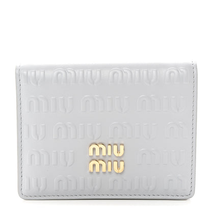 Miu Miu MIU MIU Calfskin Logo Embossed Bi-Fold Compact Wallet Fiordaliso 1 of 8