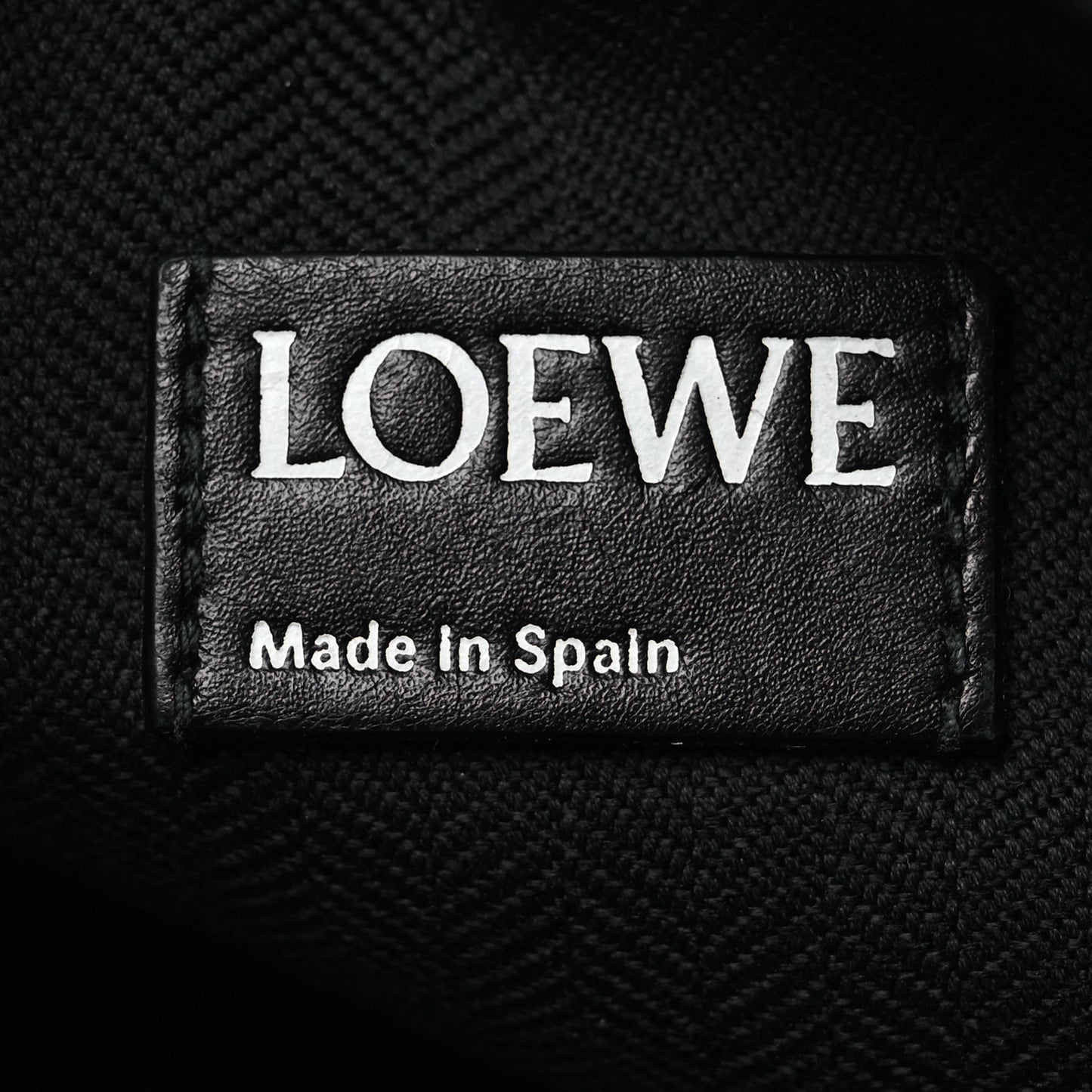 Calfskin Embossed Repeat T Pouch Black