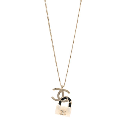 Chanel Metal Lambskin Resin CC Flap Bag Necklace Gold Black Pearly White 1 of 4