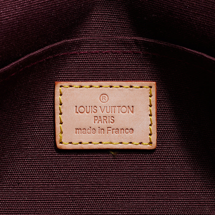 close up image of fake louis vuitton trademark stamp FASHIONPHILE