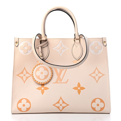 Louis Vuitton Empreinte Monogram Giant By The Pool Onthego MM Cream Saffron 1 of 4