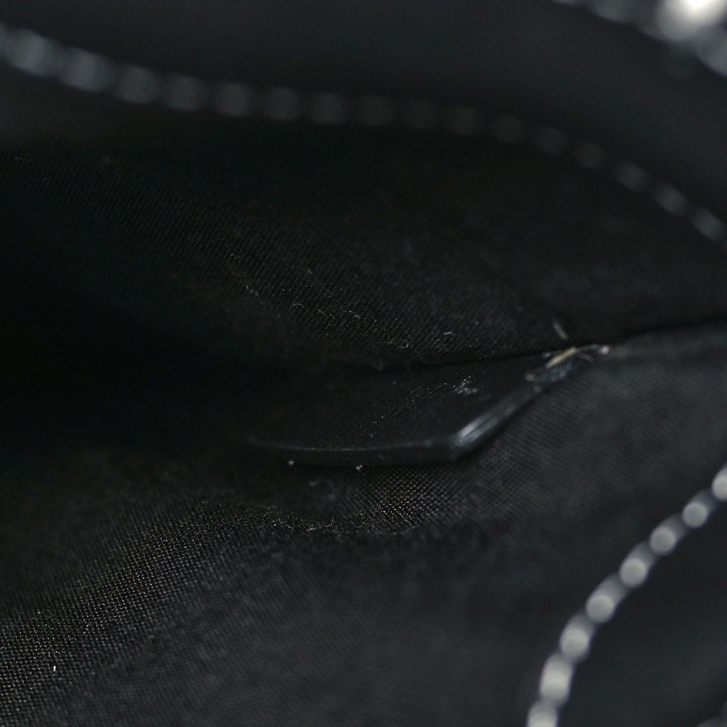 X KAWS Grained Calfskin Saddle Wristlet Black