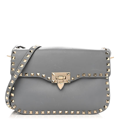 Valentino Garavani Vitello Medium Rockstud Flap Saddle Bag Light Stone 1 of 13