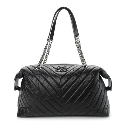 Chanel Aged Calfskin Chevron Quilted Duffle Bag Black 1 of 15