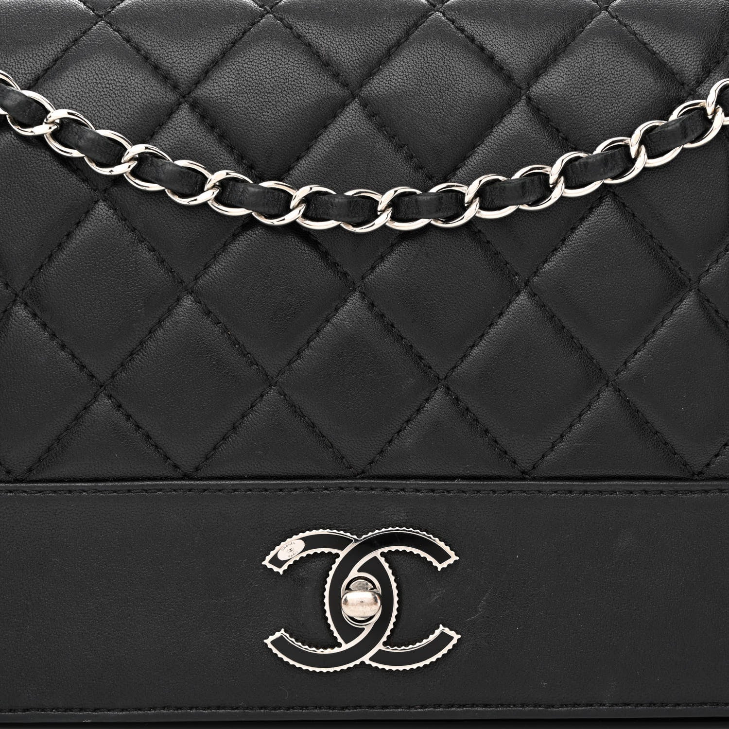 close up image of chanel sheepskin in black by FASHIONPHILE