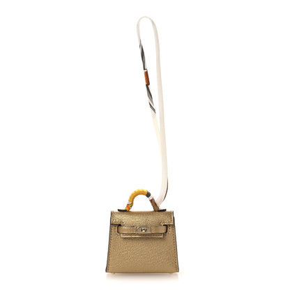 Hermes Metallic Chevre Chamkilight Mini Kelly Twilly Bag Charm Dore 1 of 7