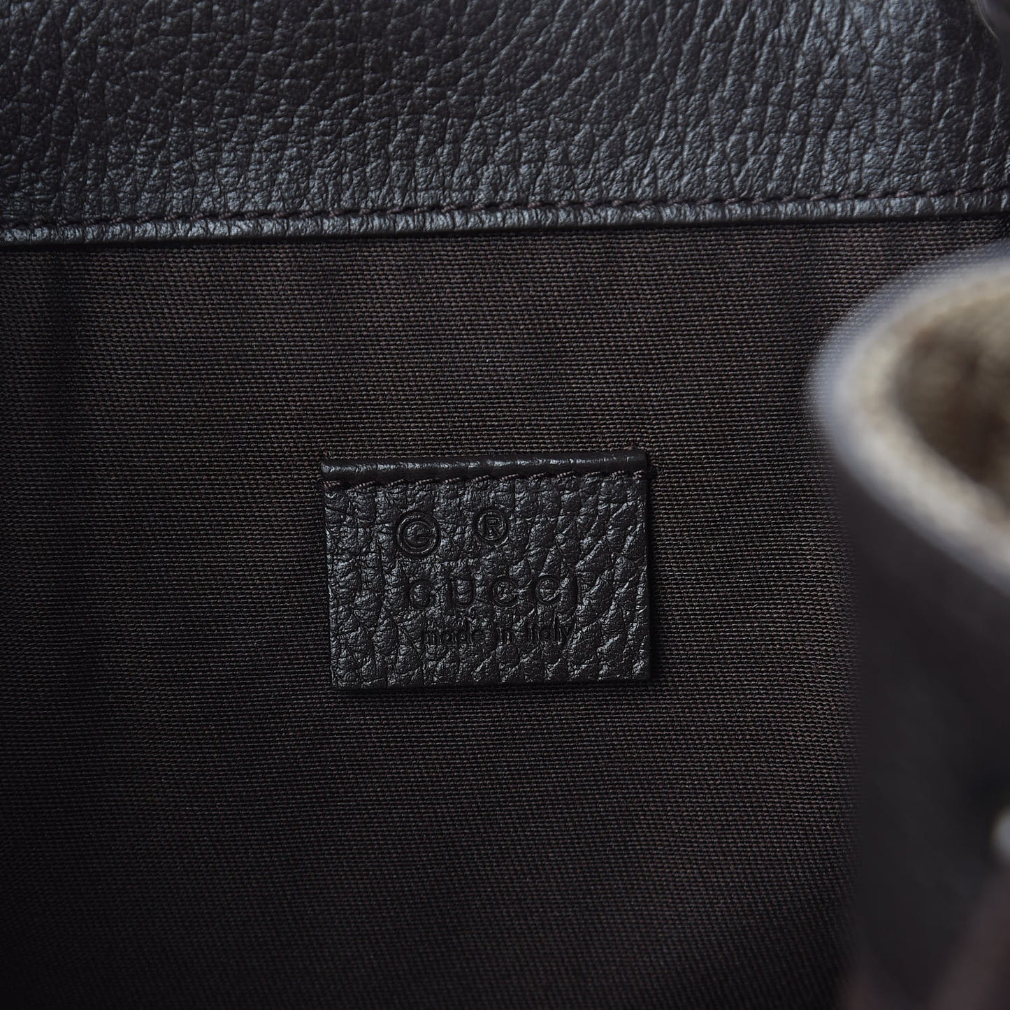 Monogram Dollar Calfskin O Drawstring Backpack Beige Ebony Testa di Moro Dark Chocolate
