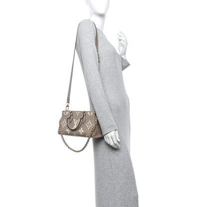 Louis Vuitton Empreinte OnTheGo East West Dove Cream 2 of 9