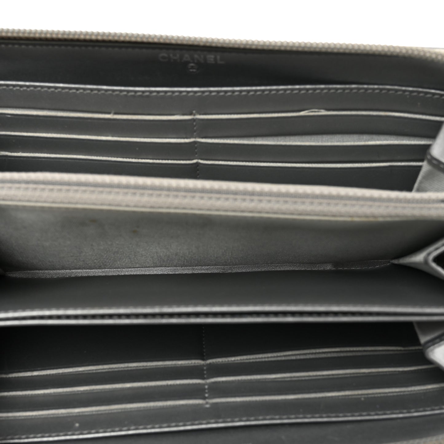 Metallic Caviar Quilted Boy Zip Around Wallet Silver