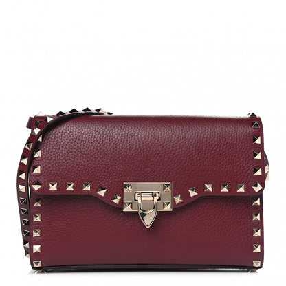 Valentino Garavani Pebbled Calfskin Medium Rockstud Flip Lock Crossbody Bag Rubin 1 of 5