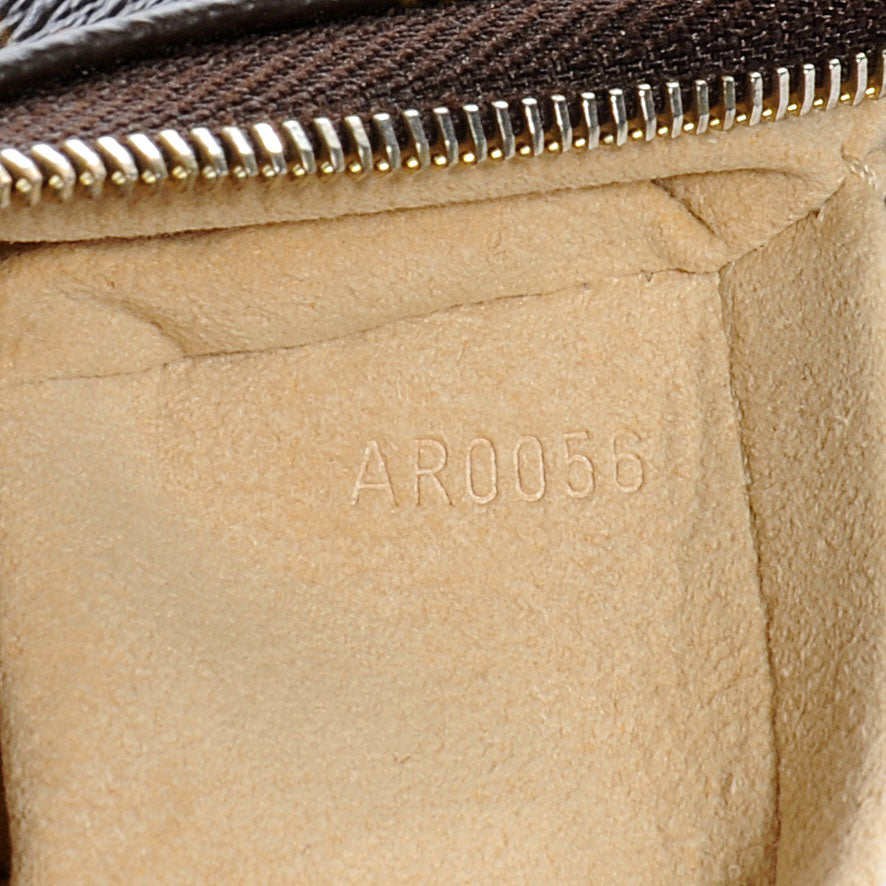 Monogram Tikal Pochette Wristlet