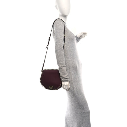 Valentino Garavani Pebbled Calfskin Rockstud Crossbody Saddle Bag Rubin 2 of 9