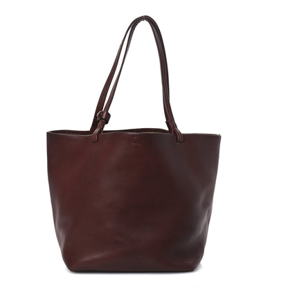The Row Polished Saddle Calfskin Park Tote Three Cognac 1 of 19