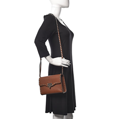 Valentino Garavani Pebbled Calfskin Medium Rockstud Flip Lock Crossbody Bag Saddle Brown 2 of 10