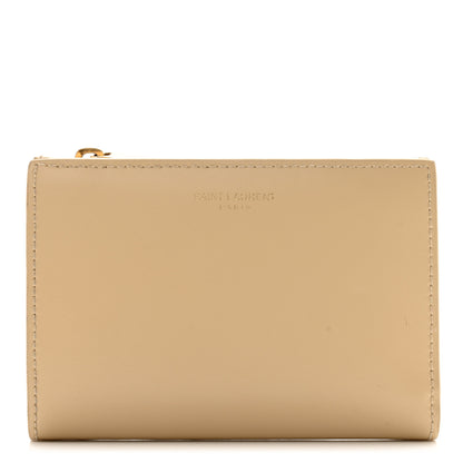 Saint Laurent SAINT LAURENT Calfskin Monogram Bi-Fold Zipped Wallet Nude Powder 1 of 11