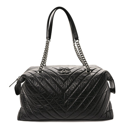 Chanel Aged Calfskin Chevron Quilted Duffle Bag Black 1 of 11