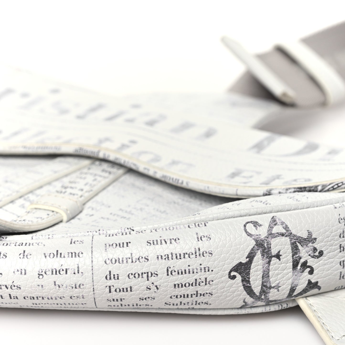X DANIEL ARSHAM Grained Calfskin Newspaper Print Saddle Bag White