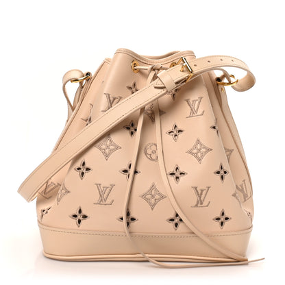 Louis Vuitton Calfskin Monogram Cutout Petit Noe Neutral 1 of 9