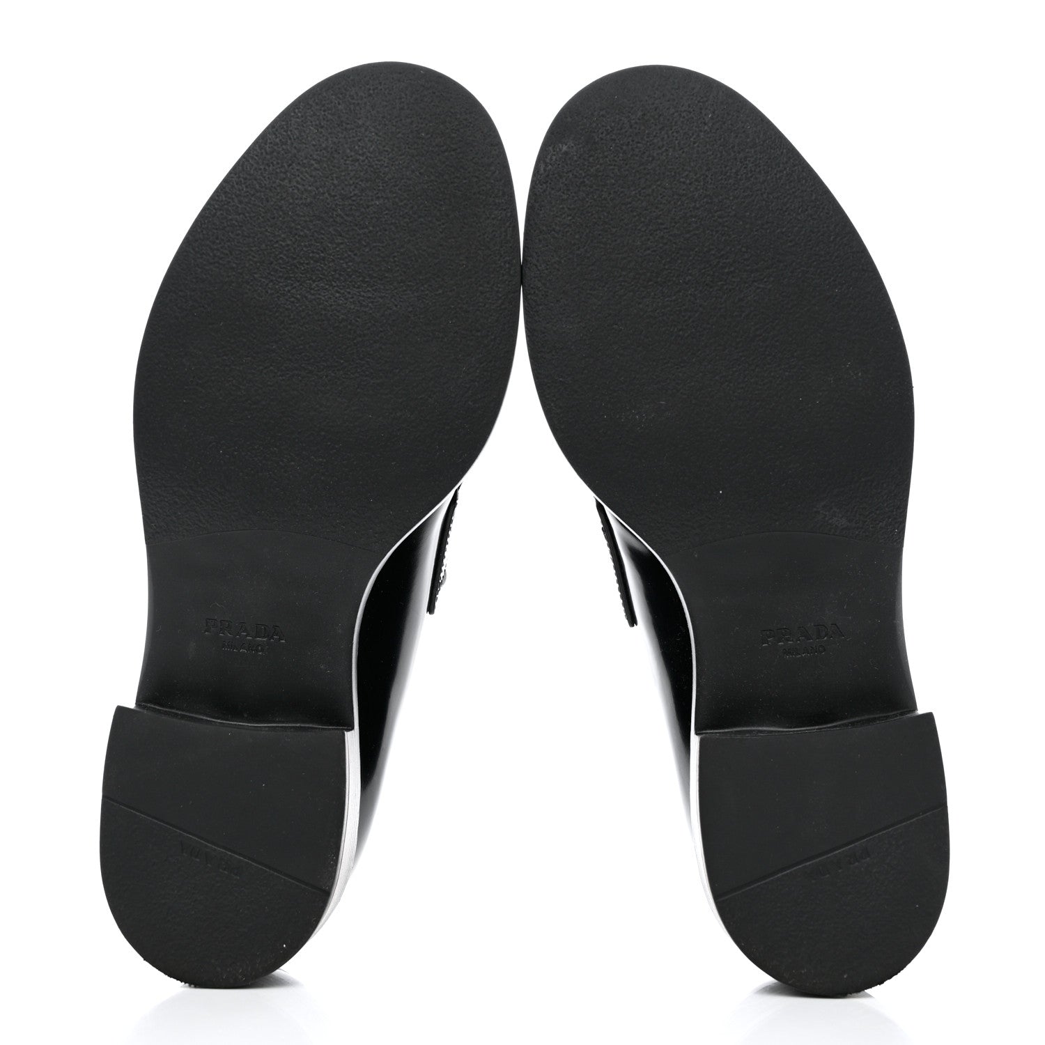 Bottom view of a pair of black Prada leather logo loafers revealing the sole by FASHIONPHILE