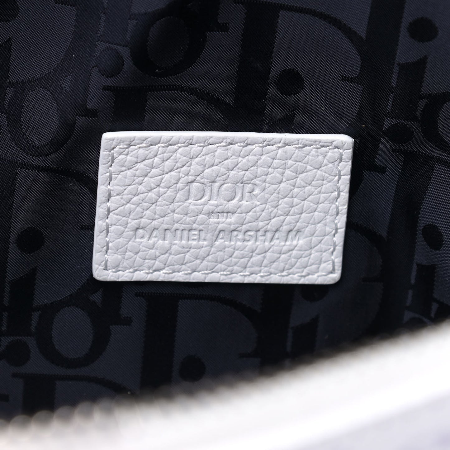 X DANIEL ARSHAM Grained Calfskin Newspaper Print Saddle Bag White