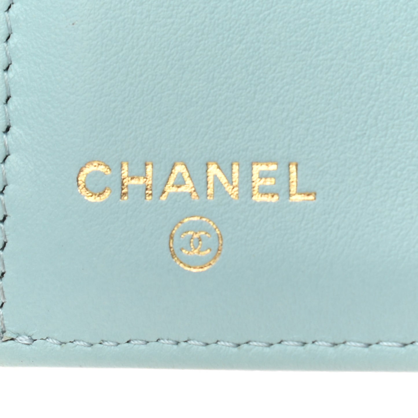 Caviar Camellia Embossed Compact Wallet Light Blue