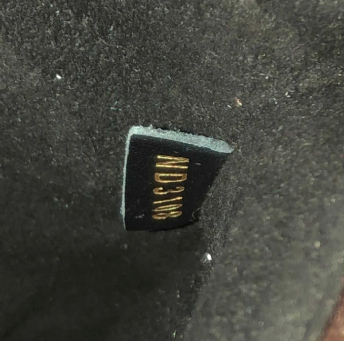 close up product image of interior fake date code for Louis Vuitton monogram Neonoe bag FASHIONPHILE