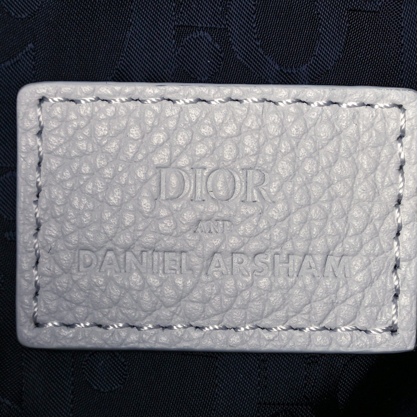 X DANIEL ARSHAM Grained Calfskin Newspaper Print Saddle Bag White