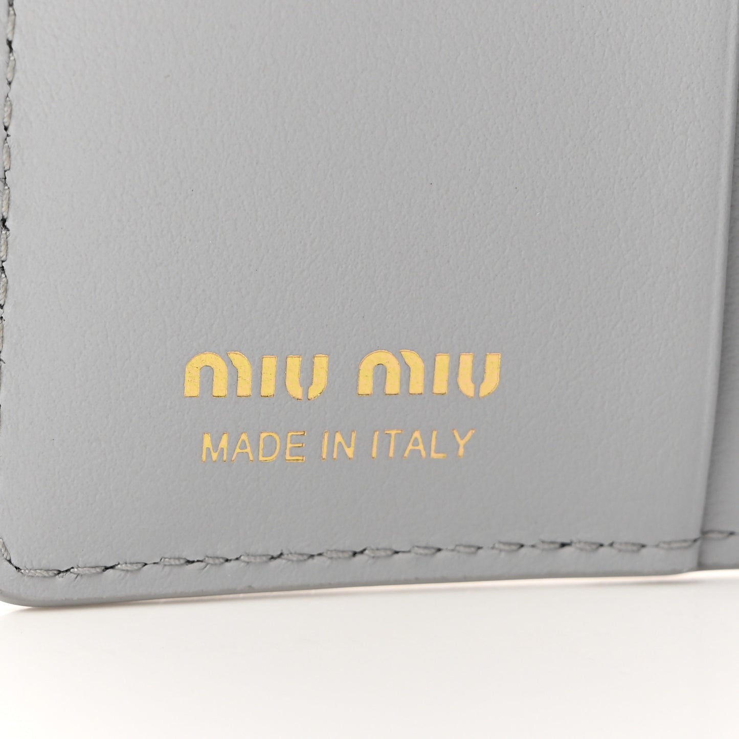 MIU MIU Calfskin Logo Embossed Bi-Fold Compact Wallet Fiordaliso