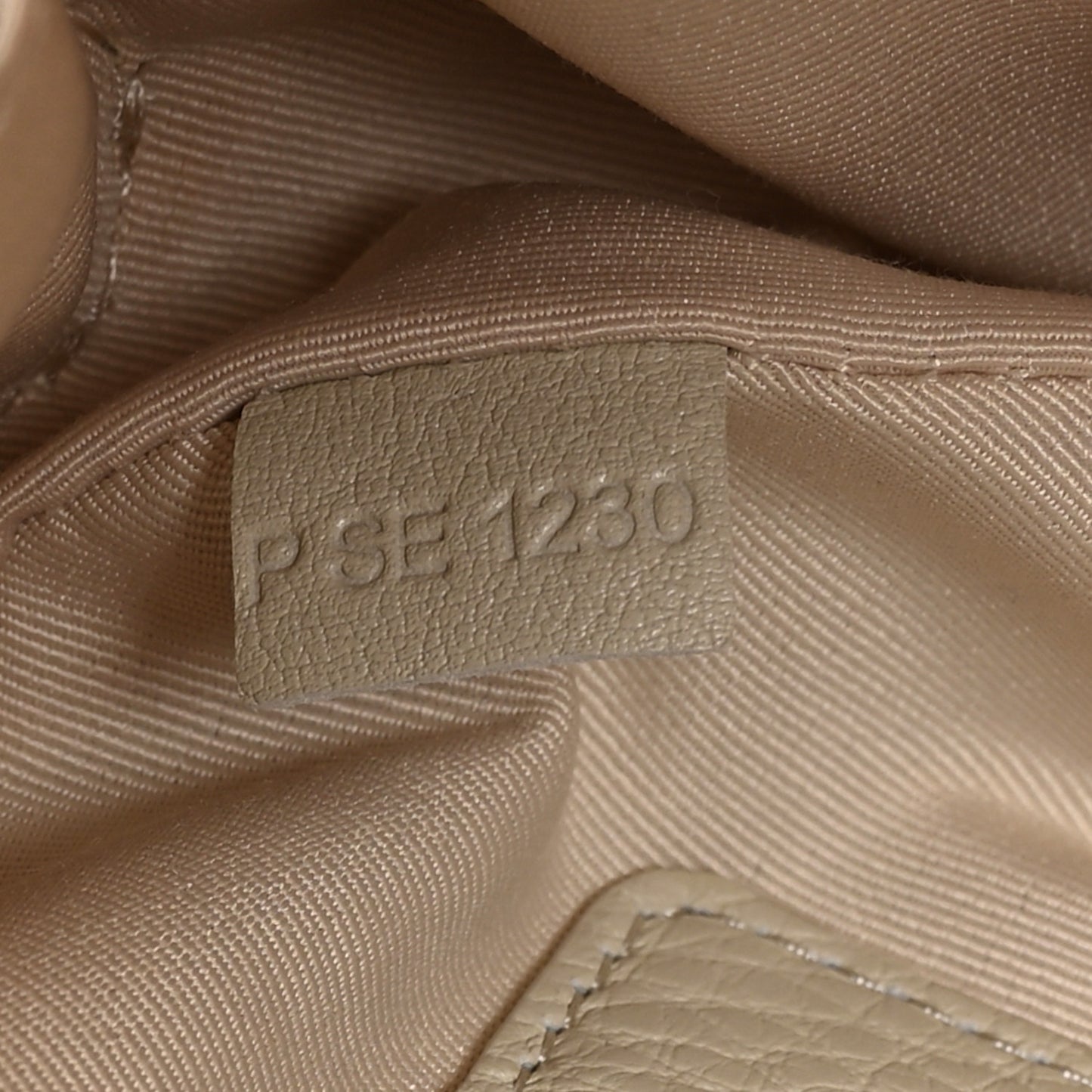 Grained Calfskin Quilted The Status Round Crossbody Oatmilk